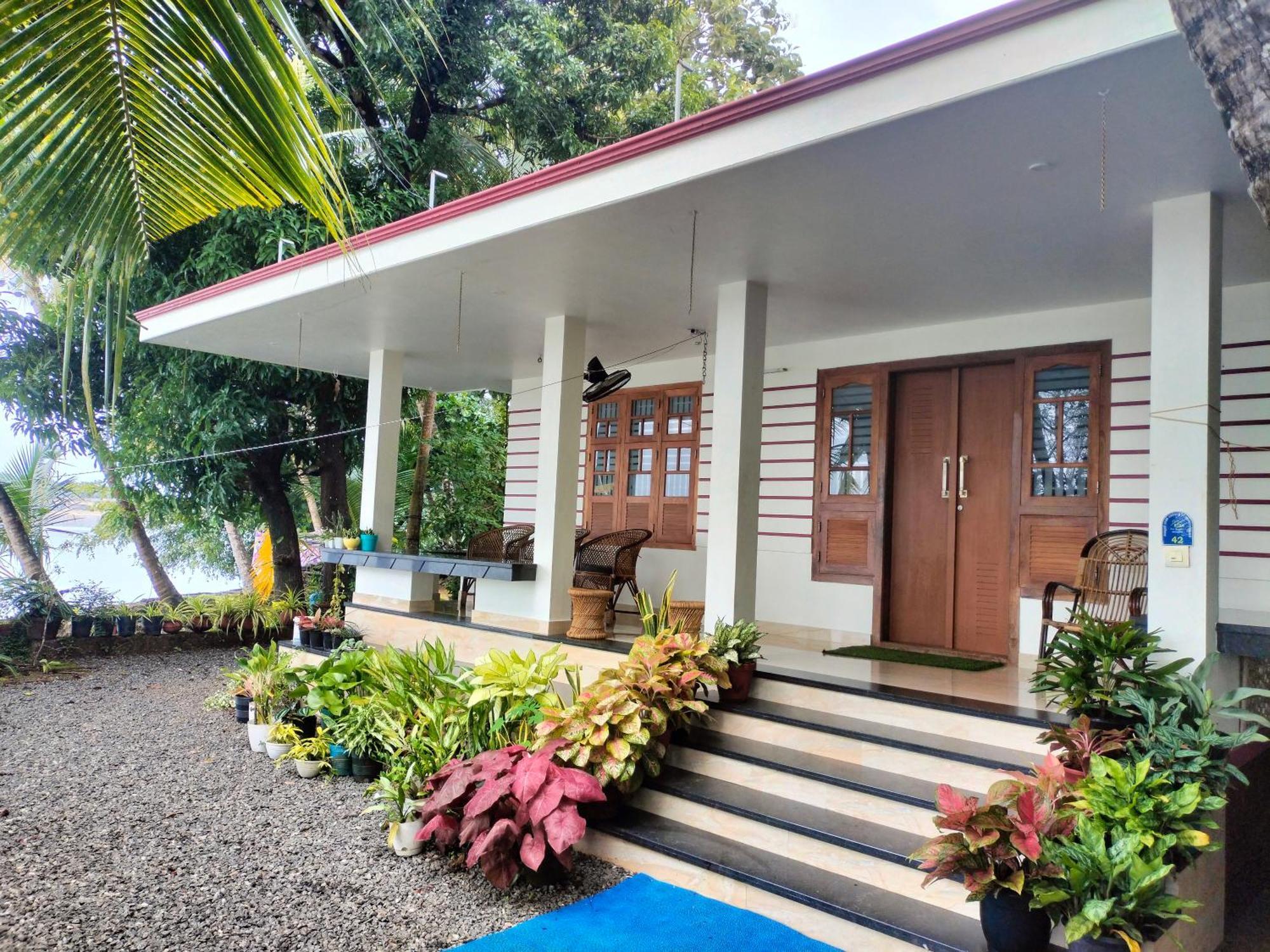 Green Island Homestay Riverside 科泽科德 外观 照片